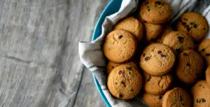 A bowl of homemade cookies on a table